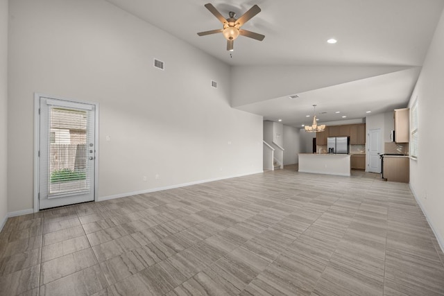 205 Falkland St, Hutto, TX 78634 - unfurnished living room featuring a chandelier, a ceiling fan, recessed lighting, and high vaulted ceiling