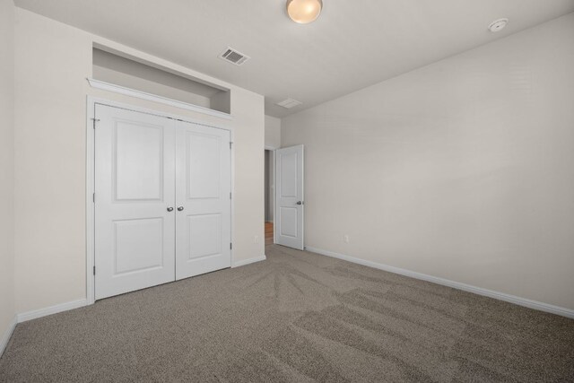 205 Falkland St, Hutto, TX 78634 - unfurnished bedroom featuring carpet flooring, a closet, and lofted ceiling