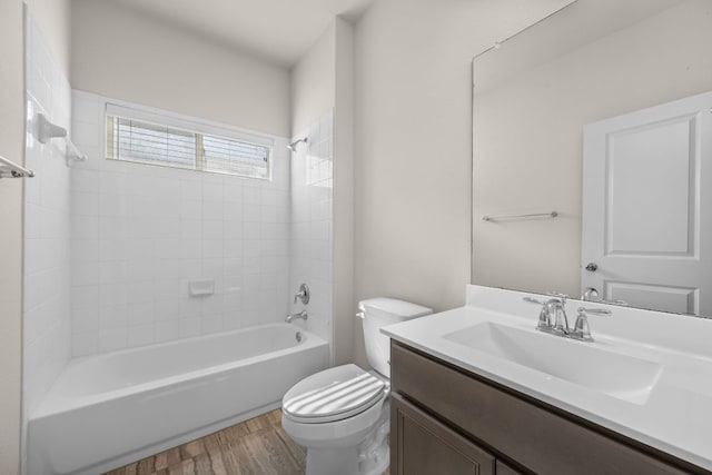 205 Falkland St, Hutto, TX 78634 - full bath with wood finished floors, vanity, and bathing tub / shower combination