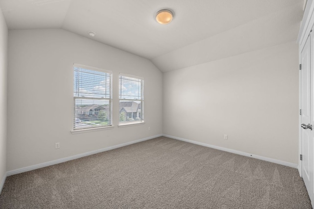 205 Falkland St, Hutto, TX 78634 - carpeted empty room with vaulted ceiling and baseboards