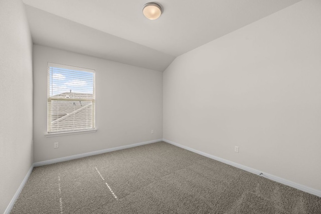 205 Falkland St, Hutto, TX 78634 - additional living space featuring carpet and vaulted ceiling