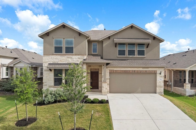 205 Falkland St, Hutto, TX 78634 - view of front of property with stucco siding, stone siding, concrete driveway, a front lawn, and an attached garage