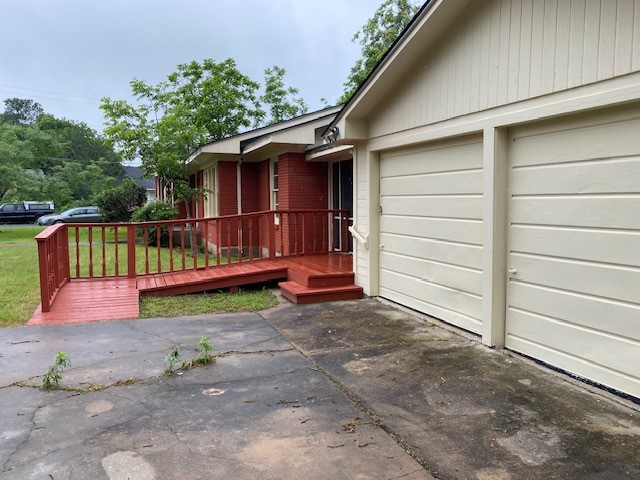 1721 E 32nd St, Austin, TX 78722 - exterior space with an attached garage and concrete driveway