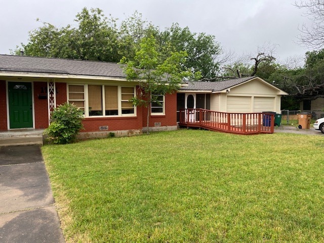 1721 E 32nd St, Austin, TX 78722 - ranch-style home featuring brick siding, a front yard, and a garage