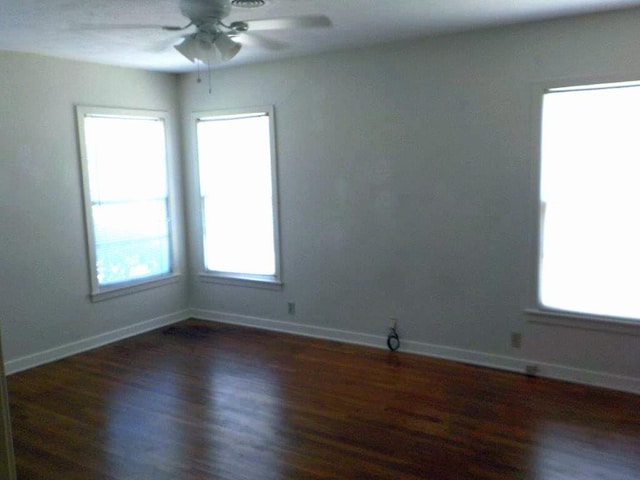 1721 E 32nd St, Austin, TX 78722 - unfurnished room with ceiling fan, wood finished floors, and healthy amount of natural light