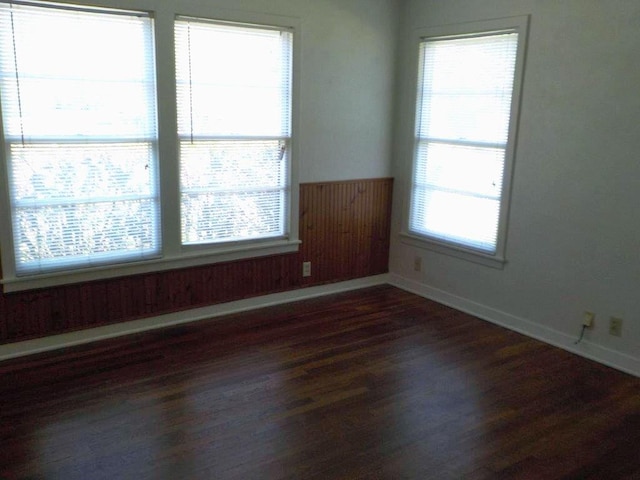 1721 E 32nd St, Austin, TX 78722 - unfurnished room with dark wood-style flooring and baseboards