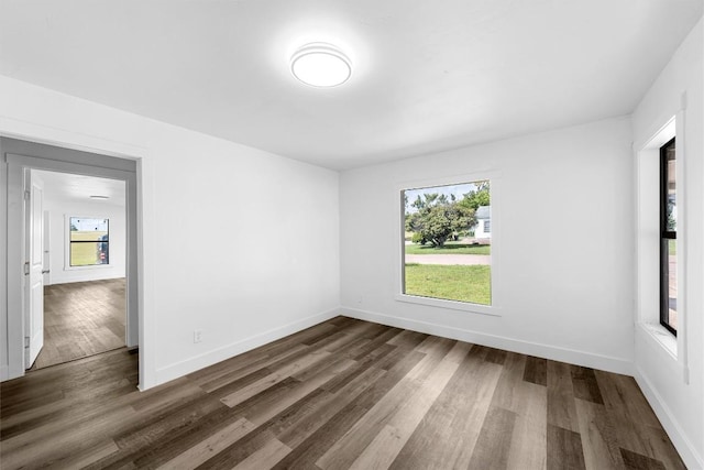 1524 E E Ave B, Temple, TX 76501 - empty room with healthy amount of natural light and dark wood-style floors