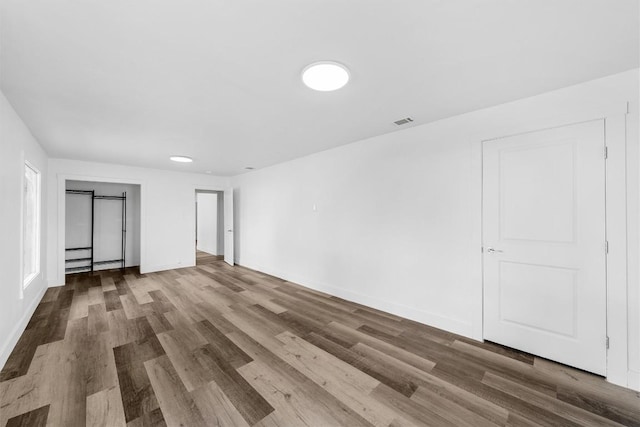 1524 E E Ave B, Temple, TX 76501 - unfurnished bedroom with wood finished floors and baseboards