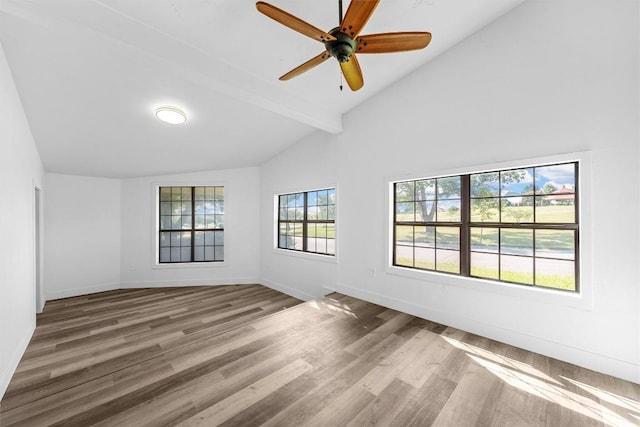 1524 E E Ave B, Temple, TX 76501 - empty room featuring wood finished floors, beamed ceiling, a ceiling fan, and high vaulted ceiling