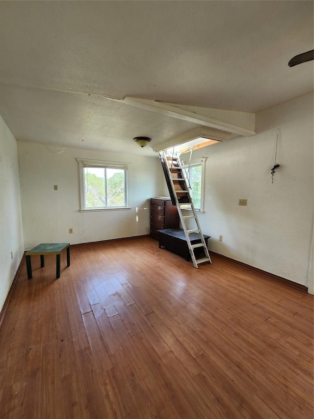 200 Nature Dr, Burnet, TX 78611 - unfurnished living room with hardwood / wood-style floors and baseboards