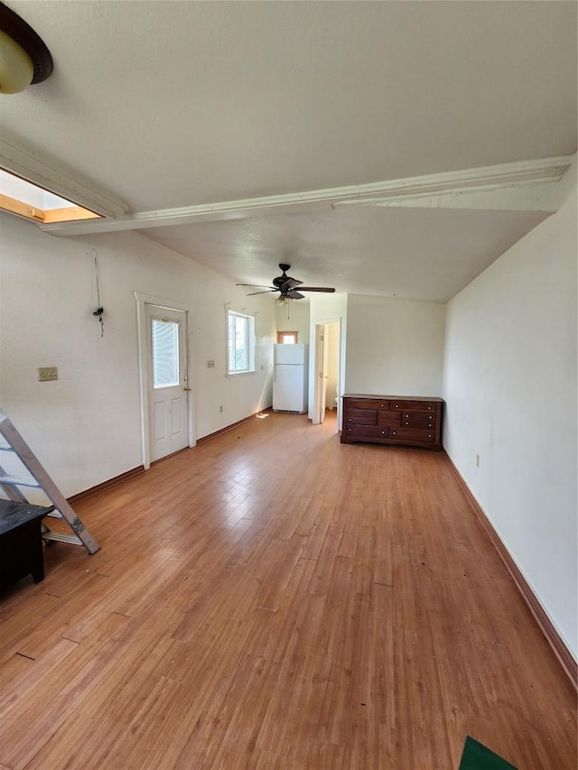 200 Nature Dr, Burnet, TX 78611 - unfurnished living room with wood finished floors and a ceiling fan