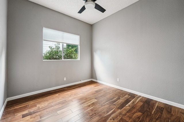 8204 Cahill Dr, Austin, TX 78729 - unfurnished room featuring wood finished floors and a ceiling fan