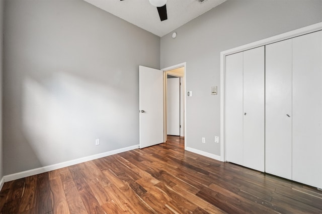 8204 Cahill Dr, Austin, TX 78729 - unfurnished bedroom featuring wood finished floors, a closet, a high ceiling, and a ceiling fan
