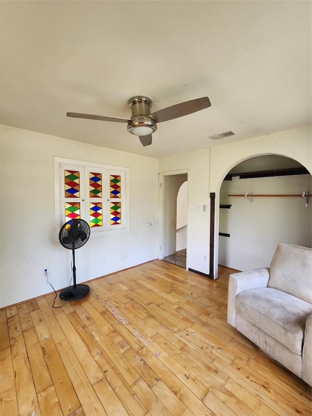 0 Monte Vista Dr, Burnet, TX 78611 - sitting room with arched walkways, ceiling fan, and hardwood / wood-style flooring