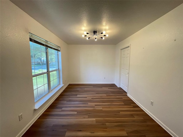 9001 Wildwater Way, Round Rock, TX 78681 - unfurnished dining area featuring a chandelier and wood finished floors