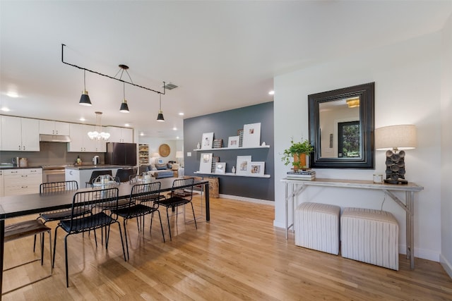 112 Louisiana Ave, New Braunfels, TX 78130 - dining space featuring a chandelier, light wood-type flooring, and recessed lighting
