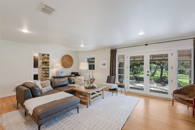 112 Louisiana Ave, New Braunfels, TX 78130 - living area featuring french doors, light wood-style flooring, plenty of natural light, and recessed lighting