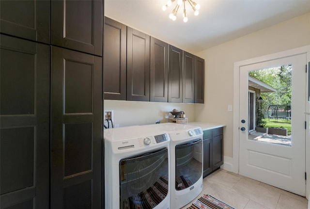 112 Louisiana Ave, New Braunfels, TX 78130 - washroom featuring cabinet space, washing machine and clothes dryer, light tile patterned flooring, and a chandelier
