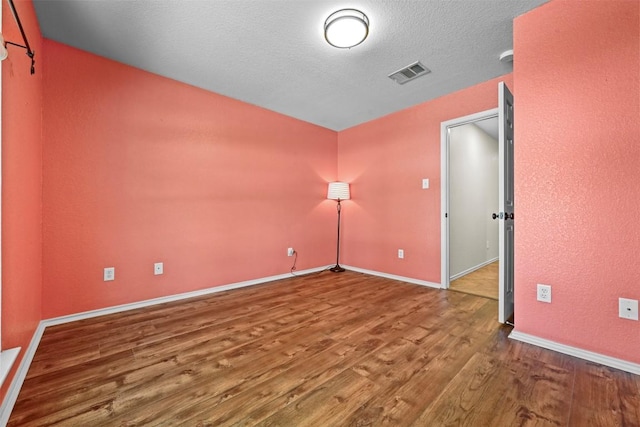 3305 Blue Ridge Dr, Round Rock, TX 78681 - spare room with wood finished floors and baseboards