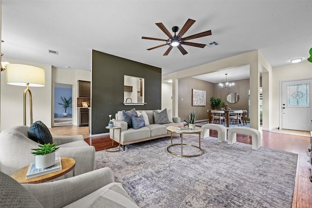 3305 Blue Ridge Dr, Round Rock, TX 78681 - living area with wood finished floors, ceiling fan, and a chandelier