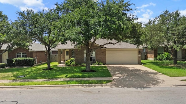 3305 Blue Ridge Dr, Round Rock, TX 78681 - ranch-style house with a garage, driveway, a front lawn, and brick siding