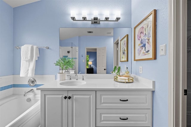 3305 Blue Ridge Dr, Round Rock, TX 78681 - bathroom featuring a bath, vanity, and a stall shower