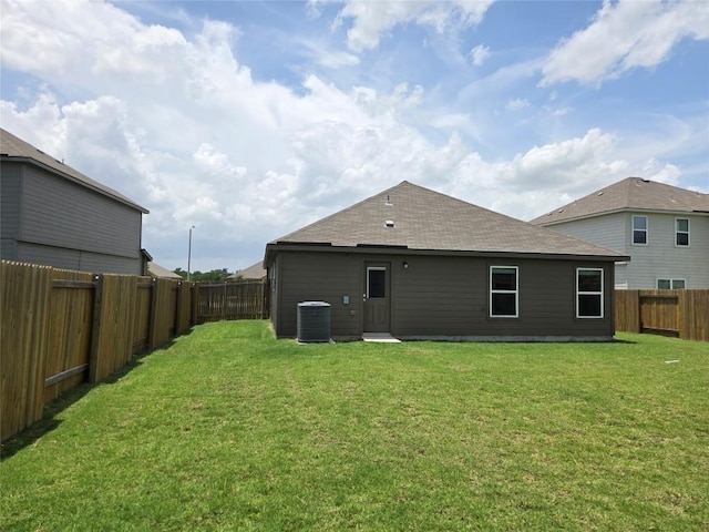 16416 Farmhouse Ln, Elgin, TX 78621 - back of property with a fenced backyard and roof with shingles