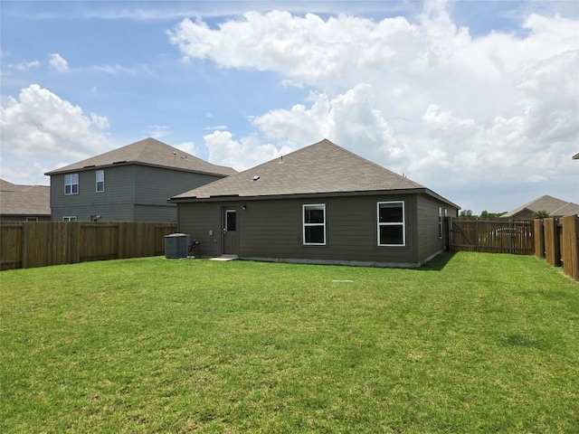 16416 Farmhouse Ln, Elgin, TX 78621 - rear view of house with a fenced backyard and a shingled roof