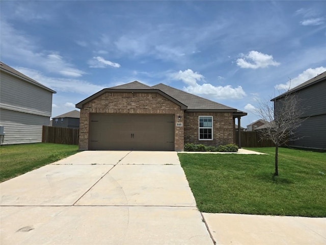 16416 Farmhouse Ln, Elgin, TX 78621 - view of front of home with brick siding, an attached garage, concrete driveway, and roof with shingles
