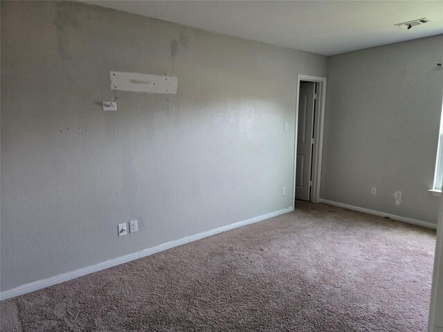 16416 Farmhouse Ln, Elgin, TX 78621 - spare room featuring carpet floors and baseboards