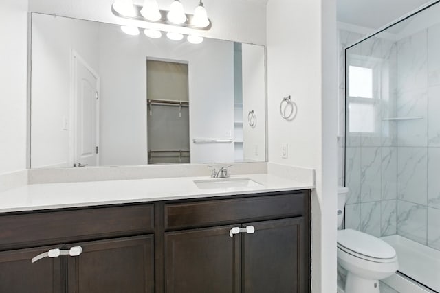 337 Spiny Lizard Ln, San Marcos, TX 78666 - bathroom with a marble finish shower, vanity, a baseboard radiator, and a closet