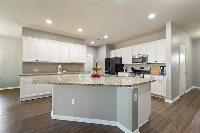 316 Shiner Ln, Georgetown, TX 78626 - kitchen featuring stainless steel appliances, dark wood-style floors, tasteful backsplash, white cabinetry, and recessed lighting
