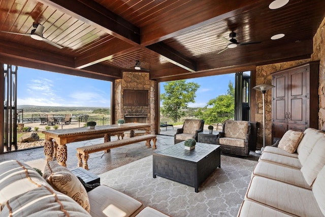 1216 Travis Bluff Way, Spicewood, TX 78669 - view of patio with an outdoor living space with a fireplace and a ceiling fan