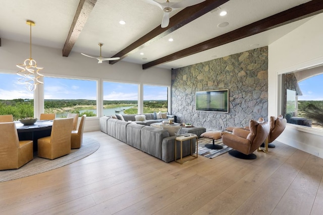 1216 Travis Bluff Way, Spicewood, TX 78669 - living area featuring a ceiling fan, wood-type flooring, and beam ceiling