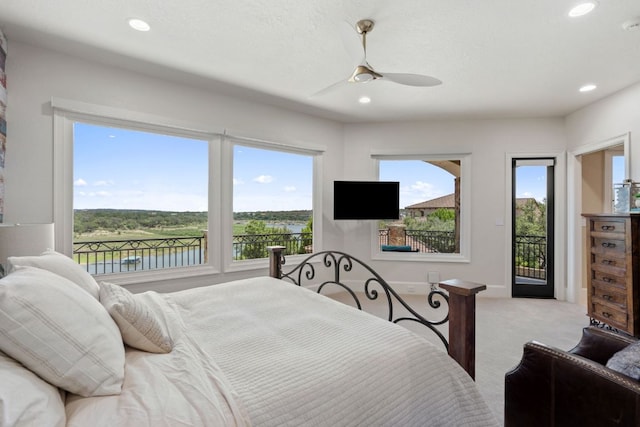 1216 Travis Bluff Way, Spicewood, TX 78669 - bedroom featuring access to exterior, light carpet, ceiling fan, and recessed lighting