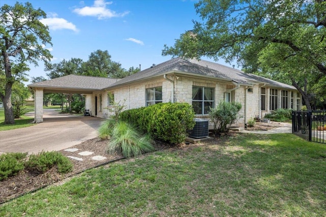 2905 Post River Rd, Cedar Park, TX 78613 - view of front of property with stone siding, a carport, a front lawn, and driveway