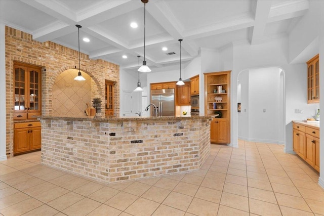 2905 Post River Rd, Cedar Park, TX 78613 - kitchen with stainless steel built in refrigerator, arched walkways, coffered ceiling, light tile patterned floors, and open shelves