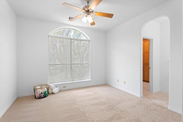 2905 Post River Rd, Cedar Park, TX 78613 - empty room with arched walkways, light colored carpet, and a ceiling fan