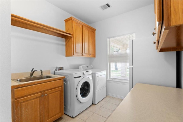 2905 Post River Rd, Cedar Park, TX 78613 - laundry room featuring cabinet space, washer and dryer, and light tile patterned floors