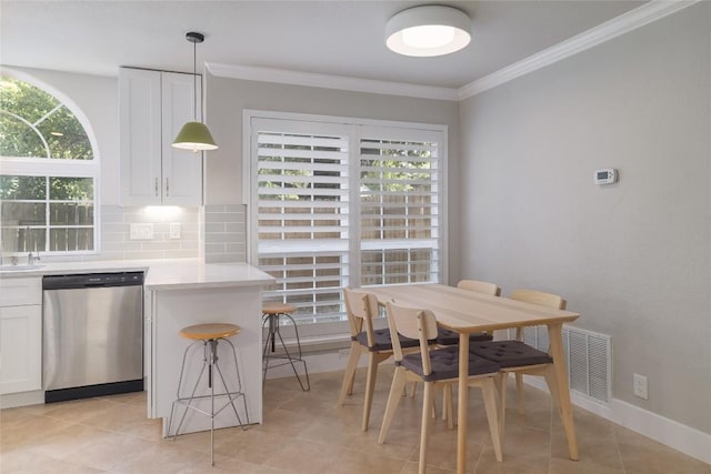 11402 Chessington Dr, Austin, TX 78750 - dining space with plenty of natural light, ornamental molding, and light tile patterned floors