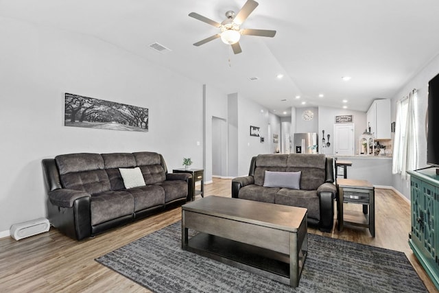 6045 Teodoro Bnd, Round Rock, TX 78665 - living room featuring vaulted ceiling, a ceiling fan, wood finished floors, and recessed lighting