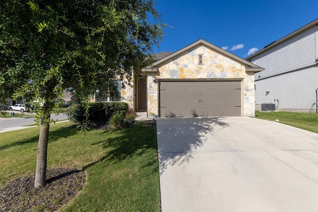 6045 Teodoro Bnd, Round Rock, TX 78665 - view of front facade featuring stone siding, an attached garage, concrete driveway, and a front lawn