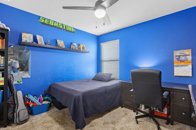 6045 Teodoro Bnd, Round Rock, TX 78665 - bedroom featuring carpet, a textured wall, an office area, and a ceiling fan