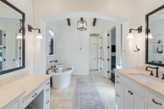 205 Hi Ridge Rd, Horseshoe Bay, TX 78657 - full bathroom featuring beam ceiling, two vanities, and a freestanding bath