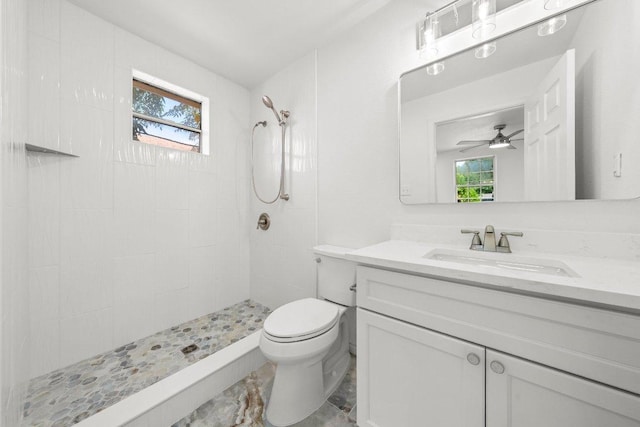 7309 Blessing Ave, Austin, TX 78752 - bathroom with vanity, a tile shower, and a ceiling fan