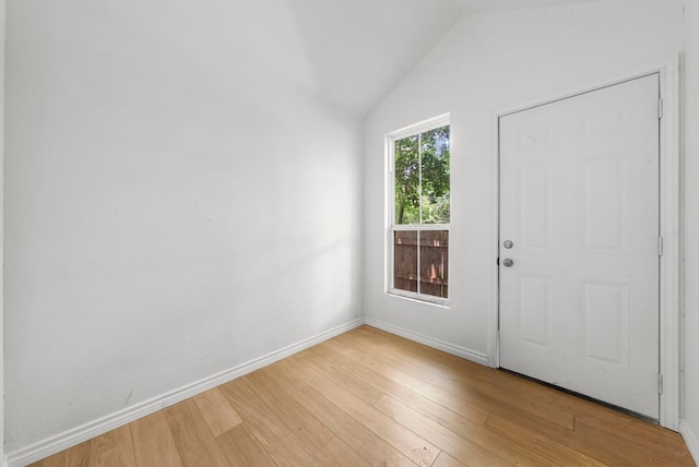7309 Blessing Ave, Austin, TX 78752 - foyer entrance with light wood-type flooring and lofted ceiling