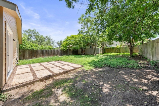 7309 Blessing Ave, Austin, TX 78752 - fenced backyard featuring a patio area and a storage shed