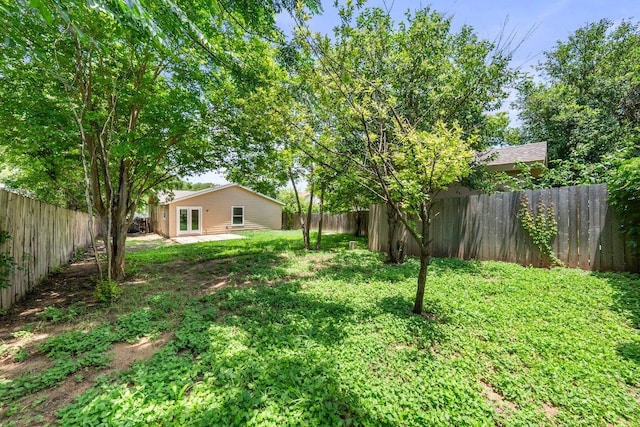 7309 Blessing Ave, Austin, TX 78752 - fenced backyard featuring a patio