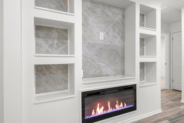 7309 Blessing Ave, Austin, TX 78752 - detailed view of wood finished floors and a glass covered fireplace