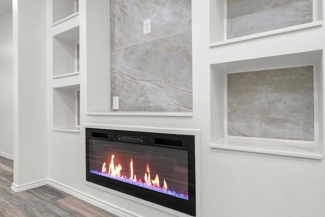 7309 Blessing Ave, Austin, TX 78752 - detailed view of wood finished floors and a glass covered fireplace
